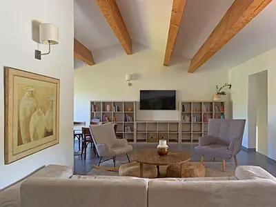 a living room with a couch and chairs and a table at Résidence Maora Village in Bonifacio