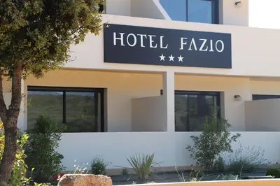 a hotel fzao sign in front of a building at Hotel Fazio in Bonifacio