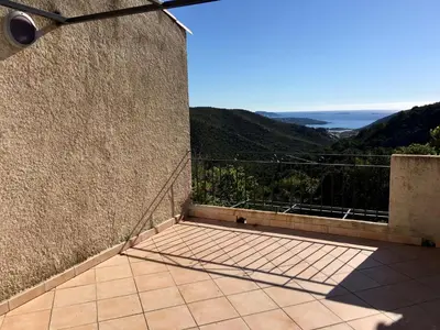 a balcony with a view of the ocean at Hameau de pietra longa Salvini PORTO-VECCHIO in Sotta