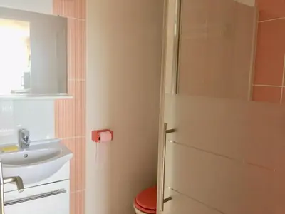 a bathroom with a toilet and a sink at Hameau de pietra longa Salvini PORTO-VECCHIO in Sotta