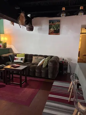 a bedroom with a bed and a coffee table at Maison de village in Ortiporio