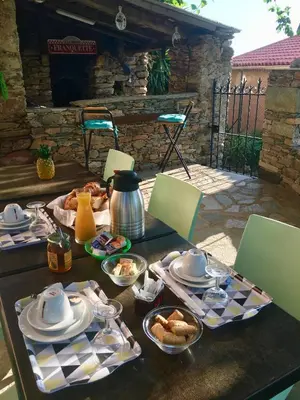 a table with a breakfast of tea and pastries at Casa di Emma in Santo-Pietro-di-Tenda
