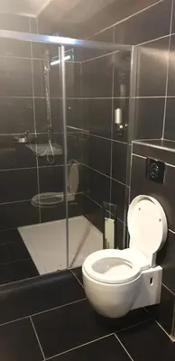 a bathroom with a toilet and a glass shower at A COSTA in Venzolasca