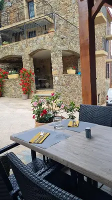 a wooden table with utensils on top at A COSTA in Venzolasca