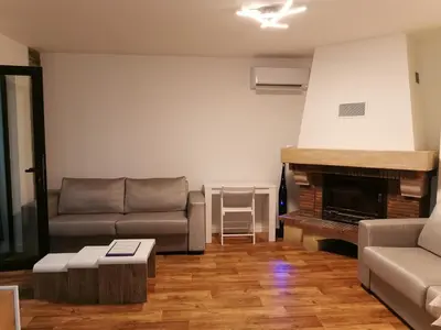 a living room with a couch and a fireplace at Appartement toit terrasse 2 chambres in Ajaccio
