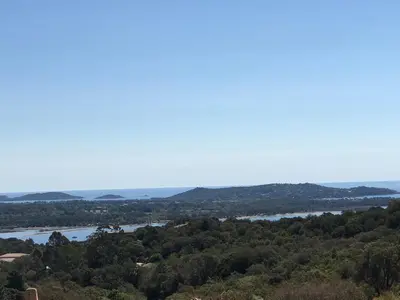 a view of a river from a hill with trees at BAVELA in Porto-Vecchio