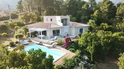 an aerial view of a house with a swimming pool at A BARMETTA in Porto-Vecchio