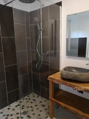 a bathroom with a shower with a glass door at Casa San Niolo in Cervione