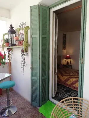 a room with a door open to a bedroom at Villa Cécile in Ajaccio