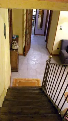 a view of a staircase in a hallway at maison de village T4 in Poggio-dʼOletta