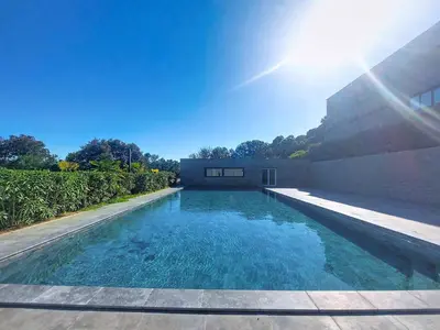 a swimming pool in the backyard of a house at Apartment Bastion-2 by Interhome in Porto-Vecchio