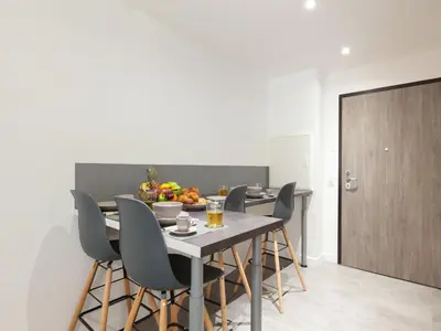 a bedroom with a bed and a living room at Apartment Bastion-2 by Interhome in Porto-Vecchio