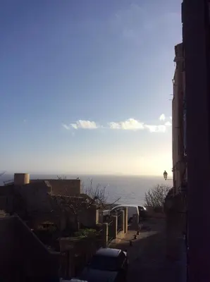 a view of the ocean from a building at Au cœur de la cité médiévale avec petite vue mer in Bonifacio
