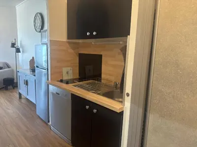 a kitchen with a sink and a counter top at Appartement n 216 Moriani plage in Santa-Lucia-di-Moriani