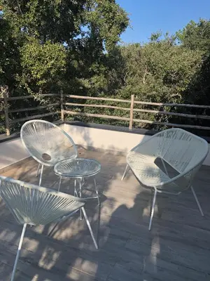 two chairs and a table on a patio at VILLA LECCI E MARE in Olmucciu