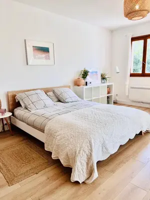 a white bedroom with a large bed in it at Loft entre mer et campagne à 5 min d'Ajaccio classé 4 étoiles in Alata