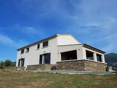 a white house on top of a hill at En plein maquis,entre mer&montagne in Vallecalle
