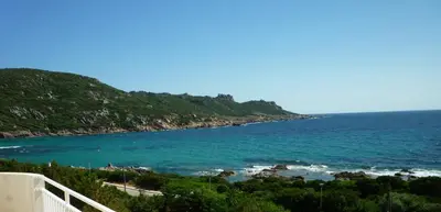 a view of the ocean from a balcony at APPARTEMENT PIED DANS L EAU ET VUE MER MAGNIFIQUE in Sartène