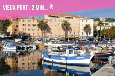 a group of boats docked in a marina with buildings at Madonuccia - Hypercentral Chic & Cosy in Ajaccio