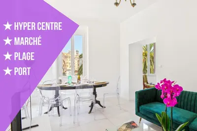 a living room with a table and a green couch at Madonuccia - Hypercentral Chic & Cosy in Ajaccio