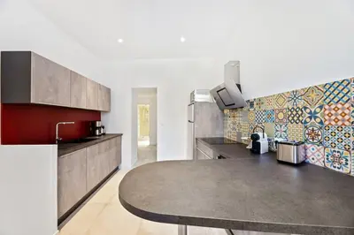 a kitchen with a sink and a counter top at Madonuccia - Hypercentral Chic & Cosy in Ajaccio