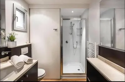 a bathroom with a shower and a toilet and a sink at Porto-Vecchio Baie Santa Giulia appartement une chambre 4-5 personnes in Porto-Vecchio