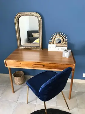 a wooden table with a mirror and a chair at Maison Ferruccio in Porto-Vecchio
