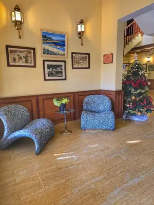 a waiting room with two chairs and a christmas tree at Castellu Rossu in Lucciana