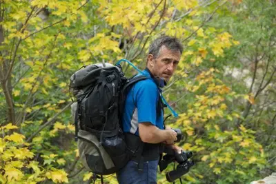 a man with a backpack and a camera at Casa Vanella in Casamaccioli