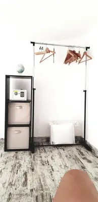 a room with a refrigerator and a shelf with a microwave at Mini-villa 1 MER in Porto-Vecchio