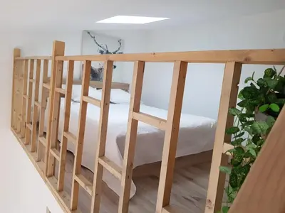 a wooden bunk bed in a room at Mini-villa 2 MONTAGNE in Porto-Vecchio