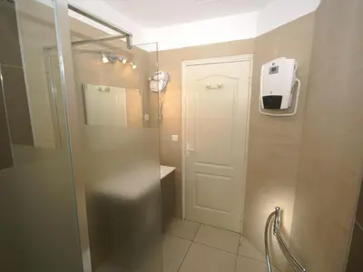 a bathroom with a shower with a glass door at Villa in Moriani-Plage near Sandy Beach in San-Nicolao