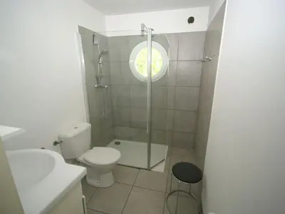 a bathroom with a toilet and a sink and a shower at Holiday Home in Moriani-Plage near Beach in San-Nicolao