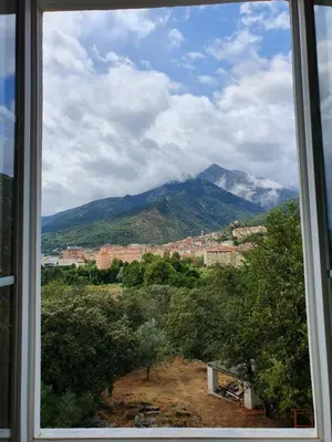 a view of a mountain from a window at Casa Guelfucci in Corte