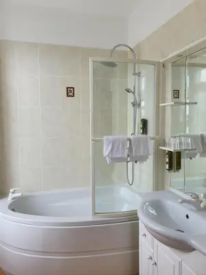 a white bathroom with a tub and a sink at Casa Guelfucci in Corte