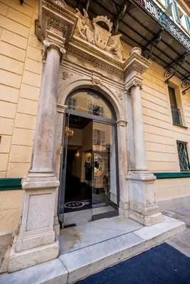 an entrance to a building with an archway on it at Hotel POZZO DI BORGO in Ajaccio
