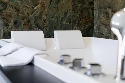 two laptops sitting on a counter in a bathroom at Hotel POZZO DI BORGO in Ajaccio