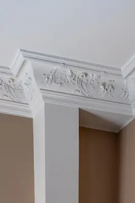 a white coffered ceiling with white trim on a room at Hotel POZZO DI BORGO in Ajaccio