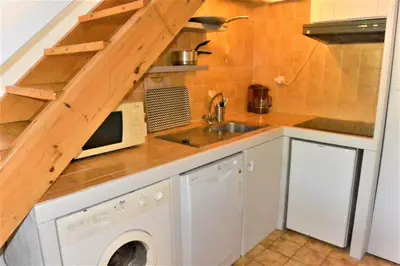 a kitchen with a sink and a microwave at CANELLA 2 in Favone