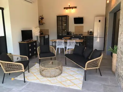 a living room with chairs and a table at villa rocca in Sotta