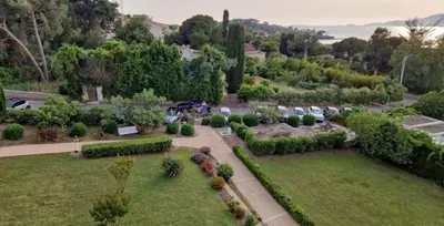 an aerial view of a garden with trees and bushes at duplex vue mer exceptionnelle in Porticcio