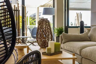 a living room with a couch and a table at Best Western Plus Ajaccio Amirauté in Ajaccio