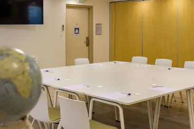 a conference room with a large white table and chairs at Best Western Plus Ajaccio Amirauté in Ajaccio