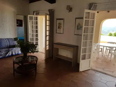 a living room with a couch and a table at Villa Gasparini in Pietrosella