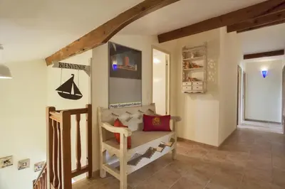 a childs room with a bunk bed and a staircase at Casa La Colombaia in Poggio-di-Nazza