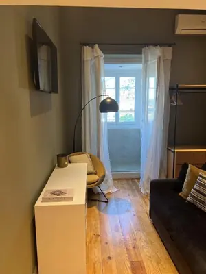 a living room with a couch and a table at Les Terrasses de Padoue in Corte