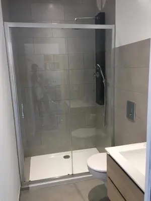 a glass shower in a bathroom with a toilet at Casa Dea in Corte