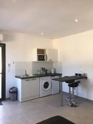a kitchen with a sink and a washing machine in it at Casa Dea in Corte