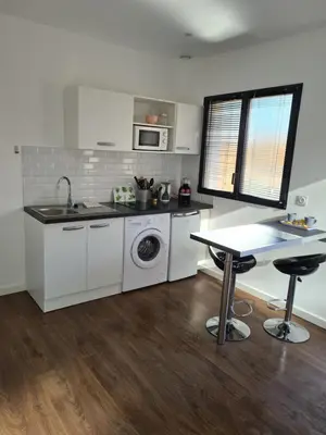 a kitchen with a sink and a washing machine at Casa Dea in Corte