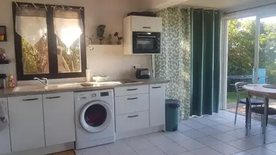 a kitchen with a washing machine and a sink at Villa Acqua Doria in Coti-Chiavari